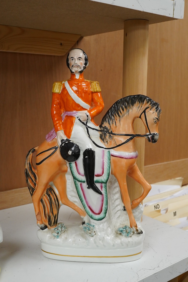 Three Staffordshire flatback figures of Garibaldi, mid 19th century, largest 29cm high